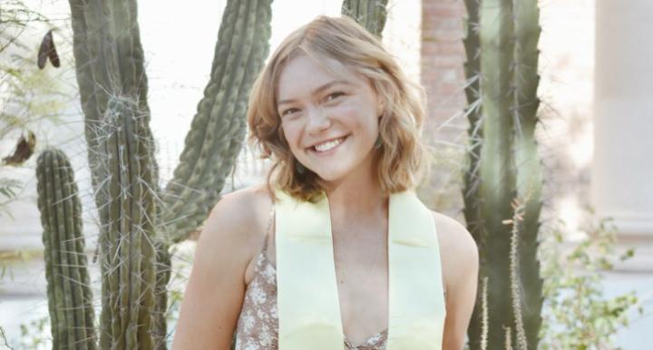 Professional headshot of Elsa Jacobson standing in front of pillar cactus